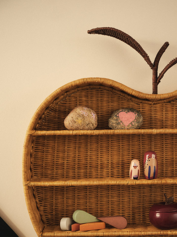 Natural rattan Apple Braided Shelf mounted on a wall