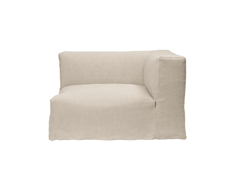 A light beige modular armchair with a textured fabric and built-in side panel.
