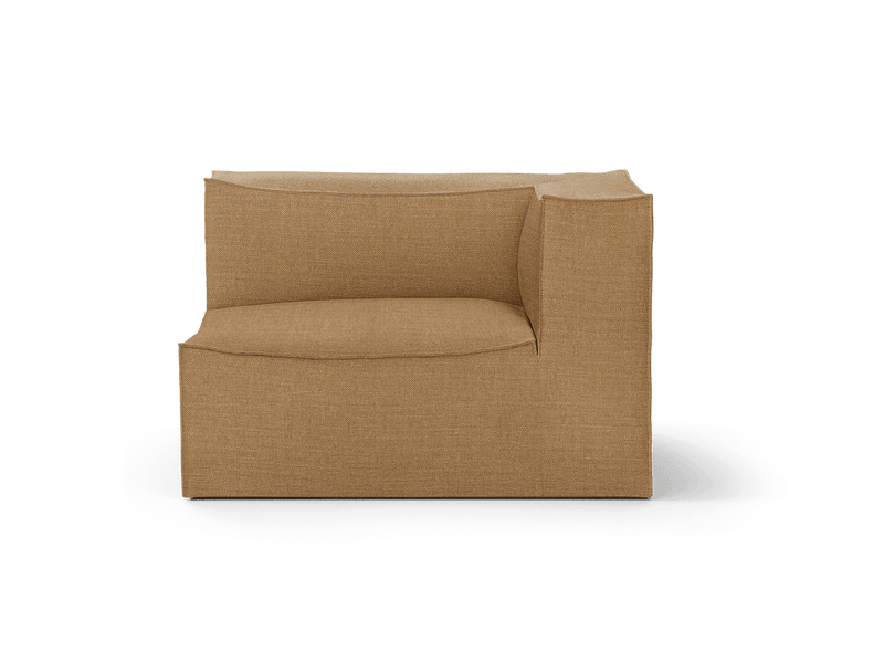 A close-up of a beige chair with a low back and soft cushions.