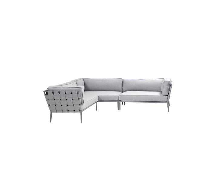 Modern light grey sectional sofa with a minimalist design and woven detailing on the backrest, perfect for stylish seating.