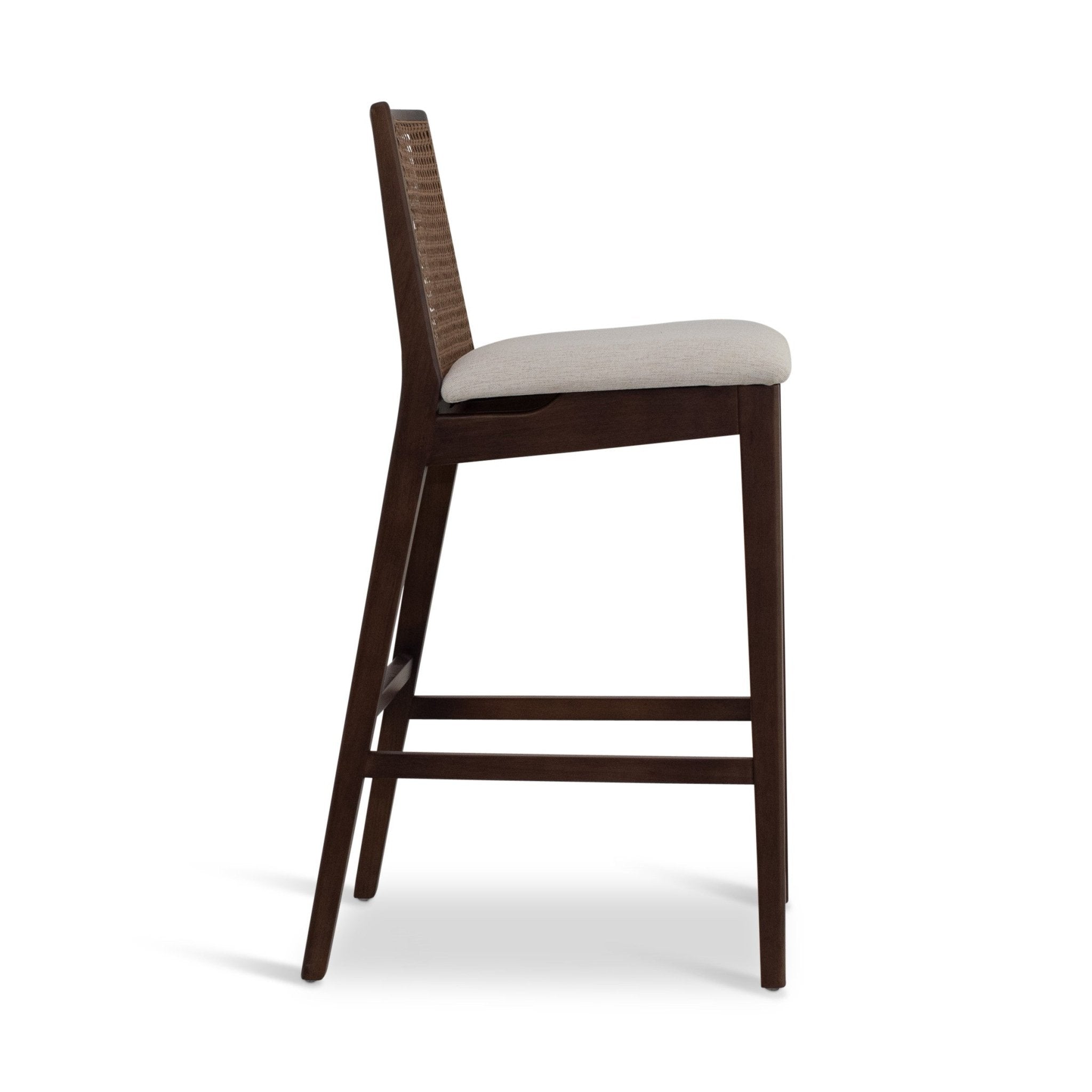 Dark brown back of caned chair shown from rear.