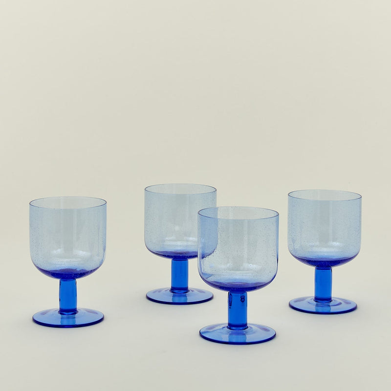 Set of four simple seeded stemware in blue.