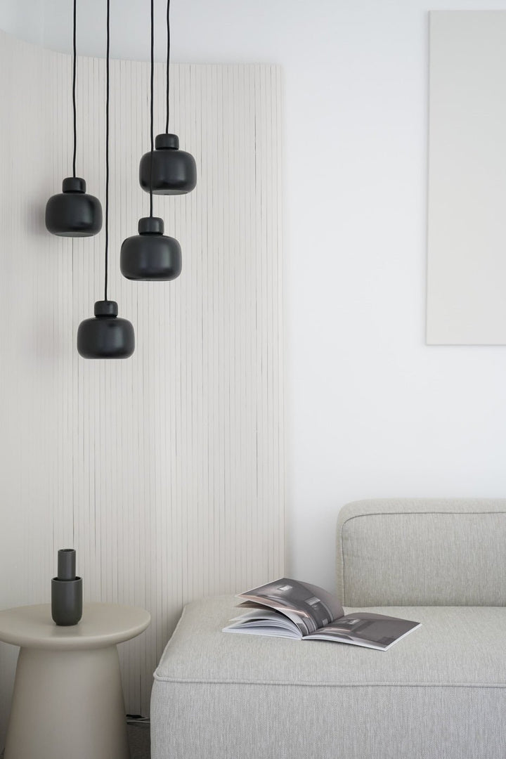 Black Stone Pendant illuminating a residential interior
