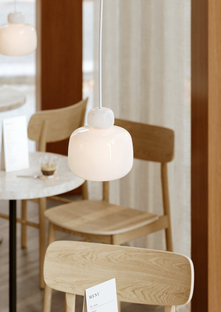 Small glass Stone Pendant in a softly lit interior