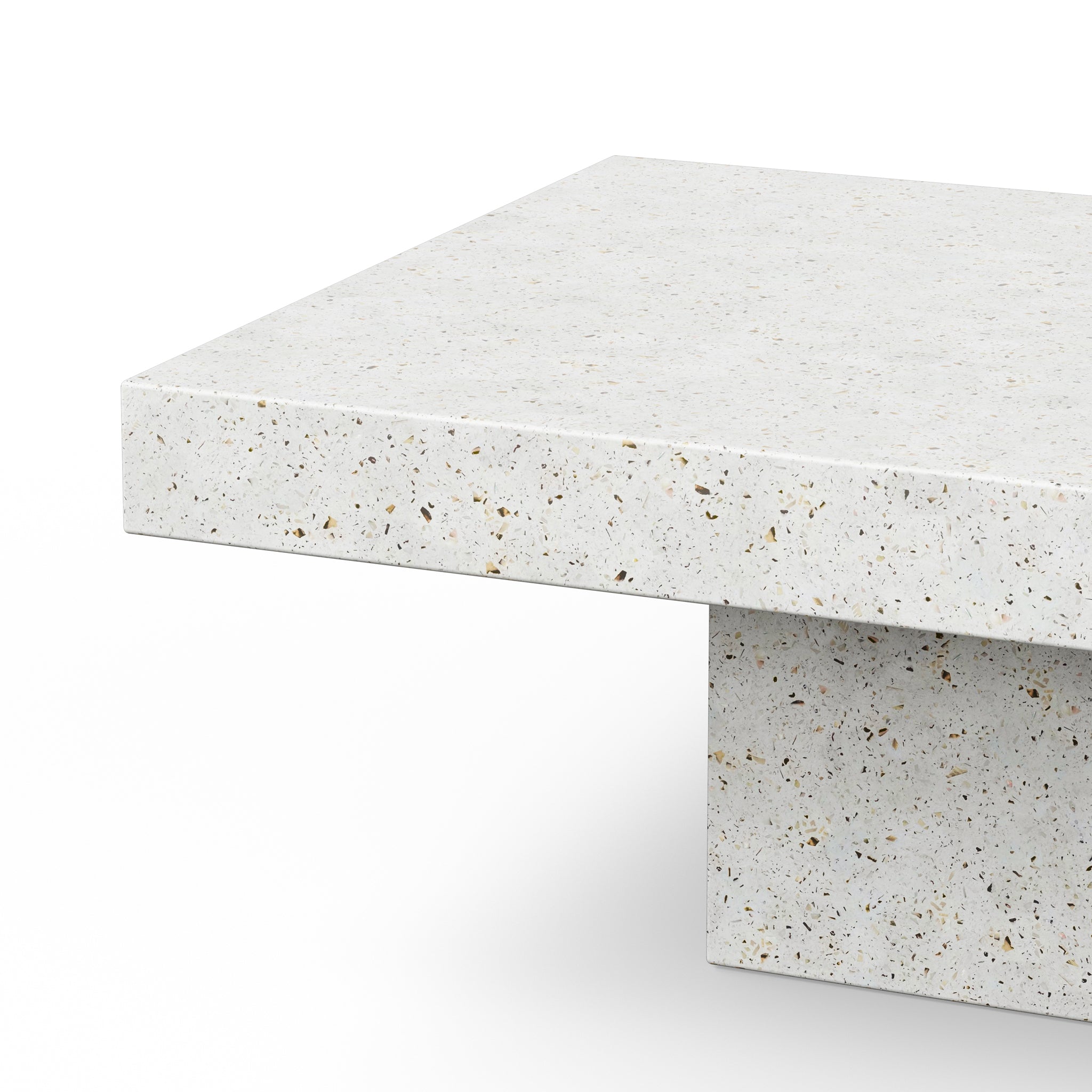 Close-up of beige/tan terrazzo tabletop edge with speckles