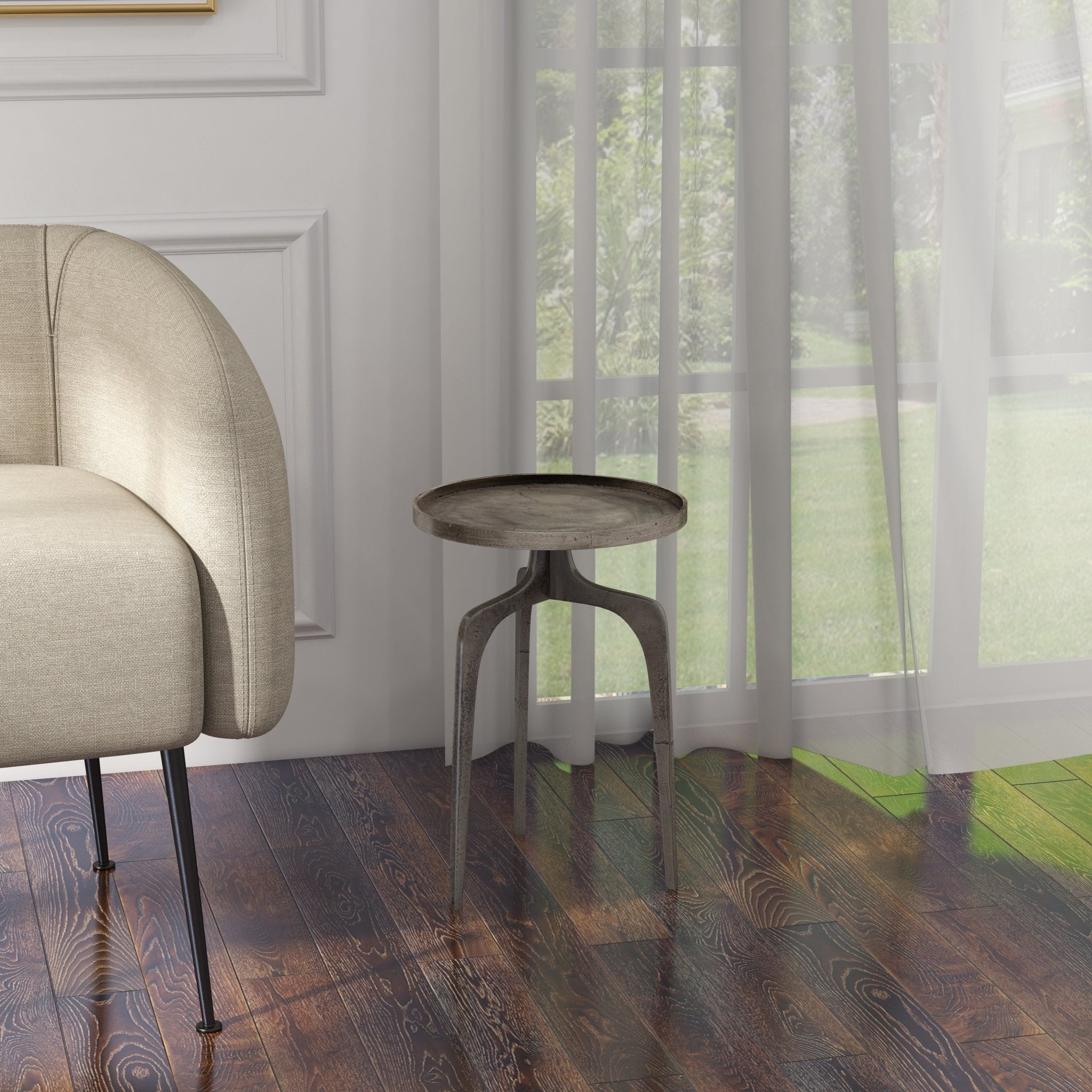 Modern metal stool with round top and pedestal-style legs in dark finish.