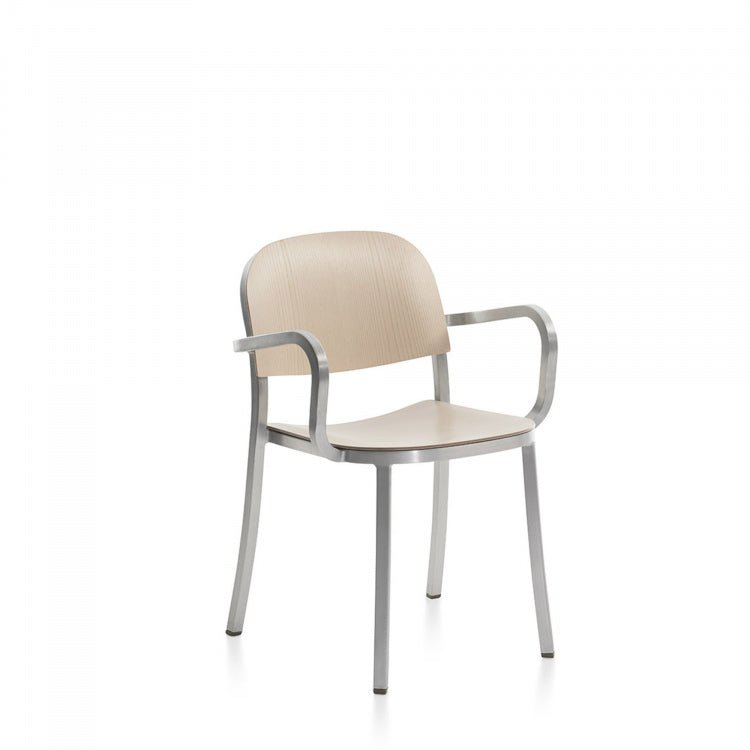 Dark brown/gray armchair with metal frame and curved armrests.