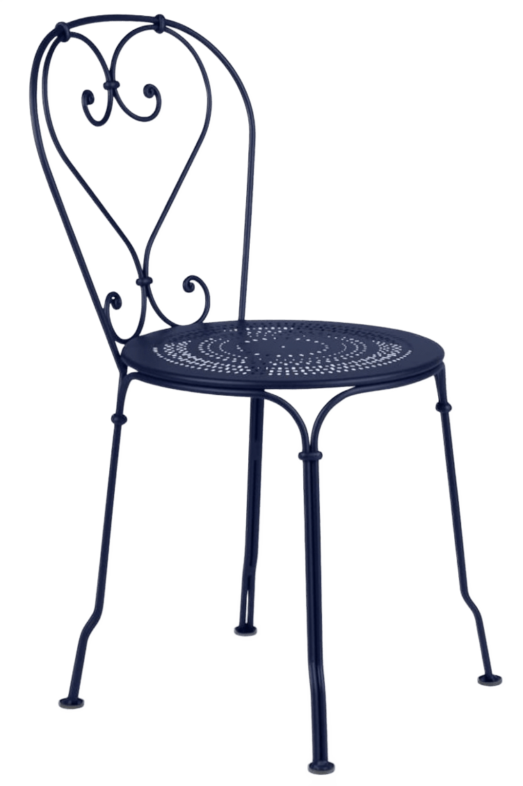 Metal chair shown in white/gray color with perforated seat and ornate back