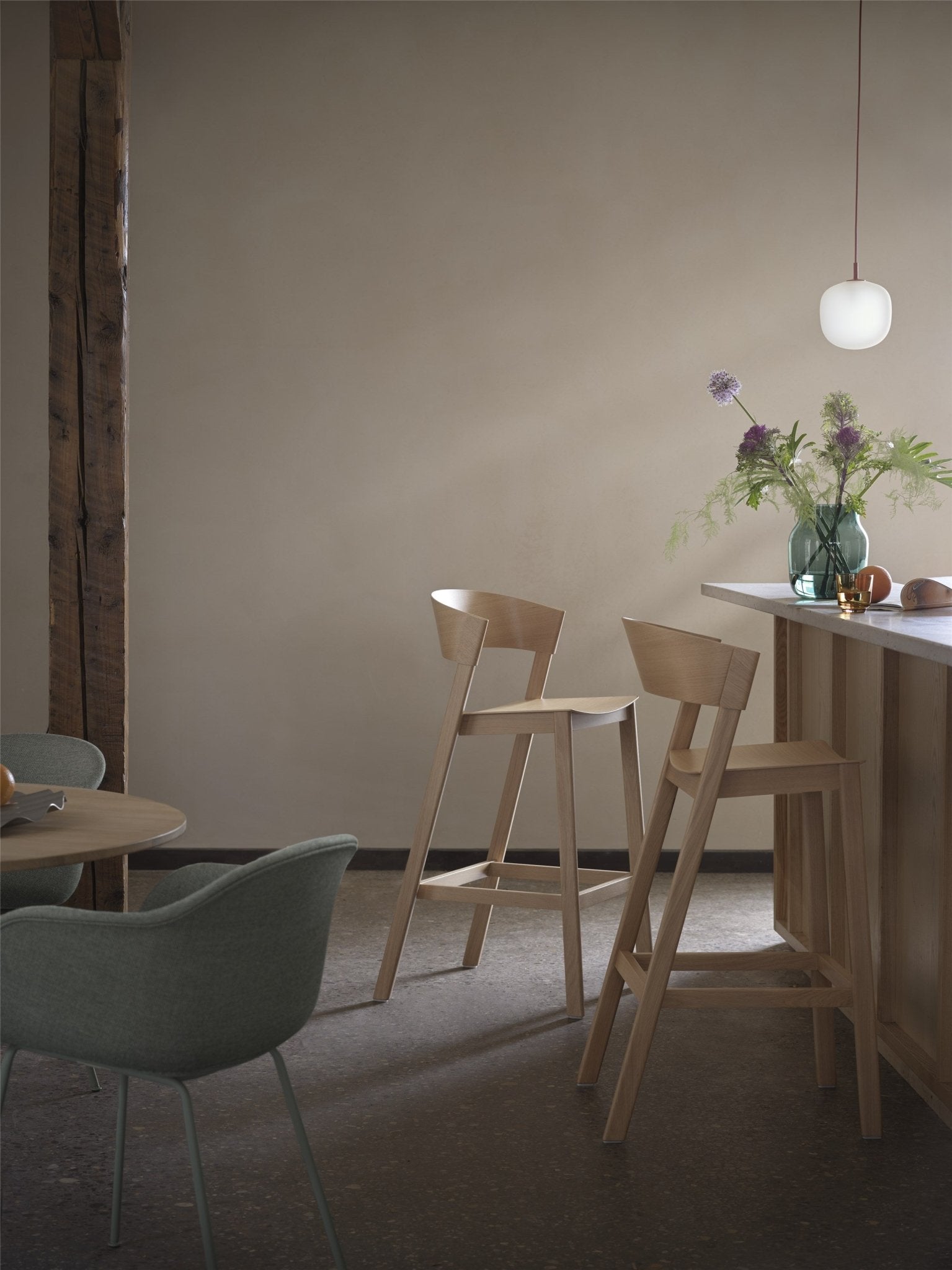 Beige wooden chair with curved backrest