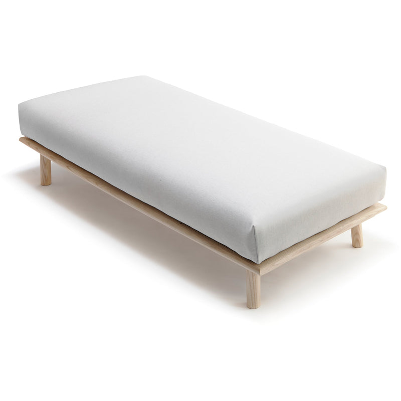 Nikari's Linea Daybed Bench with a cushion included. Perfect for a museum gallery or your home