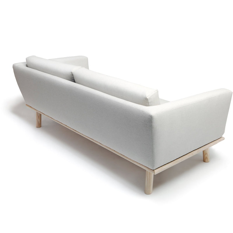 Linea Sofa by Nikari. A modern grey living room couch with a wood frame.