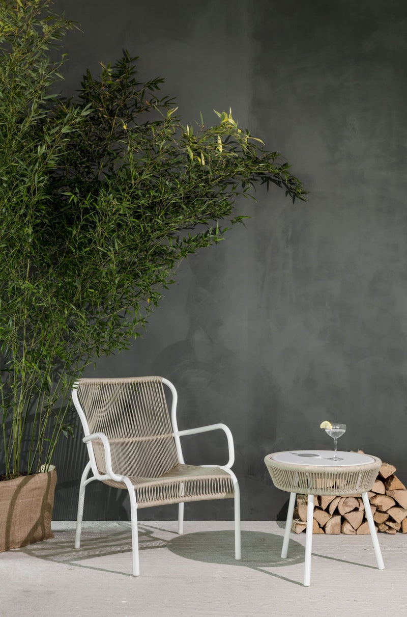 Beige/cream string chair with white frame, matching woven seat and back in a modern outdoor style.