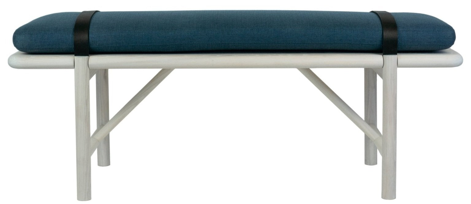 Bench against a white wall with black legs and tan leather straps; additional shots show shoe hooks beneath