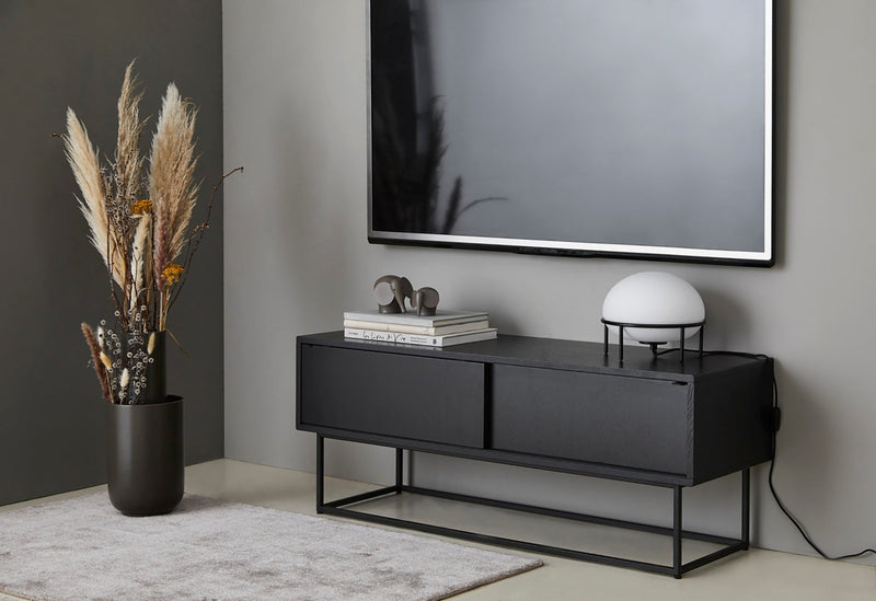 Close-up showing a black protective edge and a small wooden tab/knob detail on the cabinet corner.