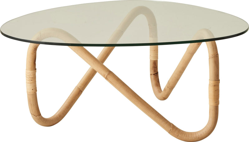 Coffee table with a wavy rattan base and a sleek, round glass top